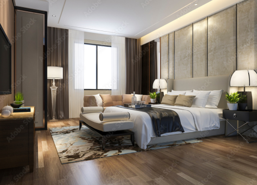 Modern bedroom design in Austin with neutral tones, accent lighting, and comfortable bedding.