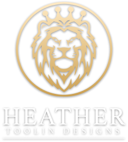 Heather Toolin Designs logo with a crowned lion emblem, symbolizing elegance and luxury in interior design.