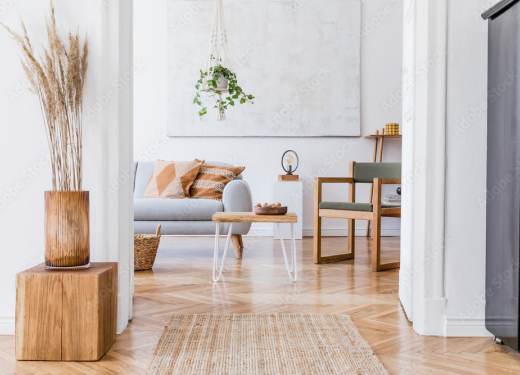 Bright minimalist living room in Austin with natural wood decor, soft neutral tones, and indoor plants.