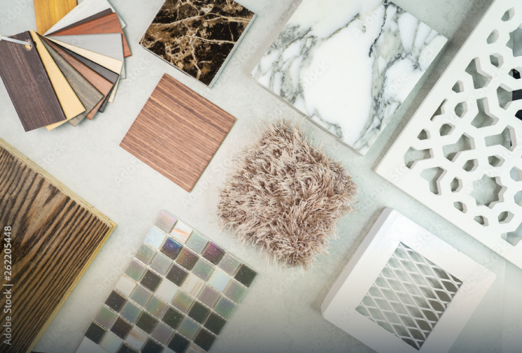 Interior design material samples including wood, marble, and fabric swatches for modern home design.